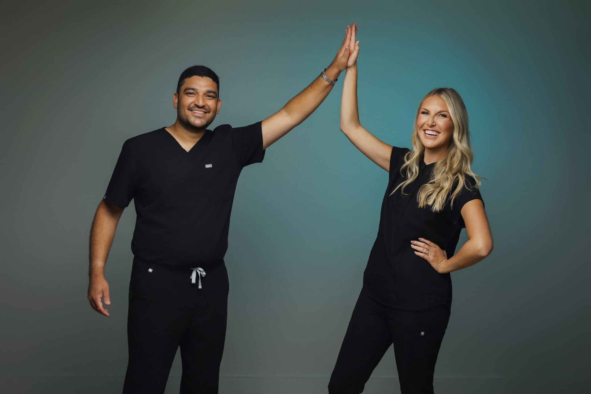 Dr. Shuaib Mirani and Dr. Ashley Lock giving a high five